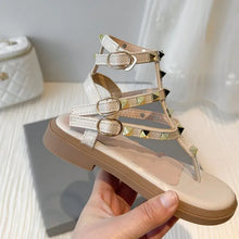 Load image into Gallery viewer, Summer children's beach shoes   style girls' Roman-style sandals with shiny rivets - classic vacation soft-soled sandals
